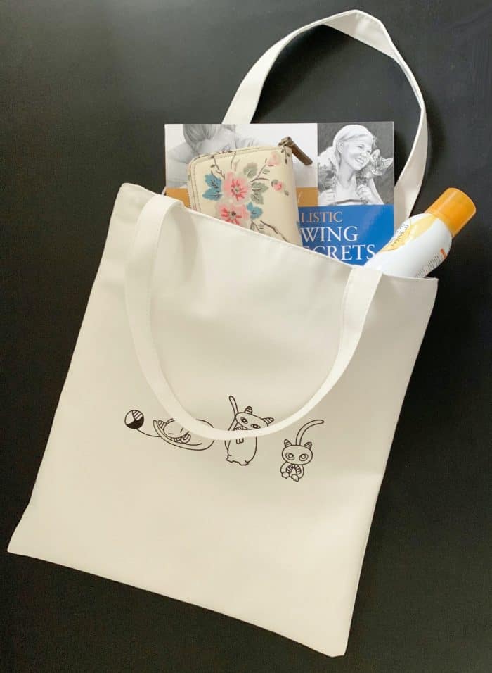 zip_canvas_bag_cat cat canvas bag with book